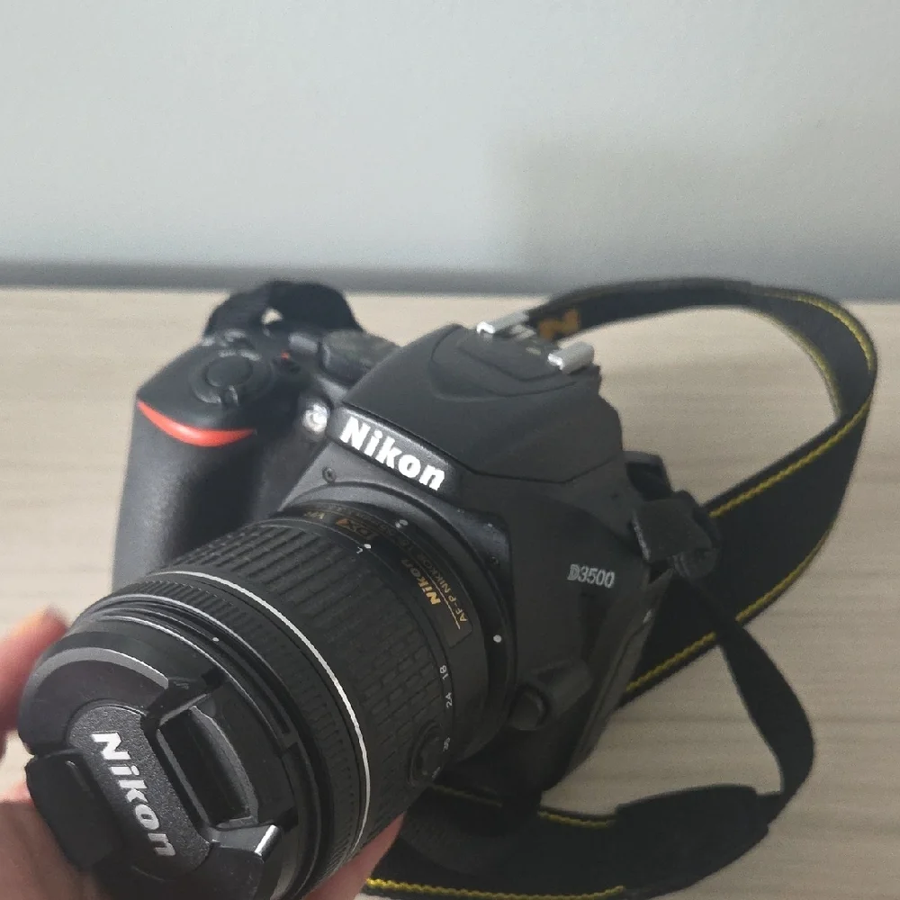 Nikon Black Camera D3500 with Zoom Lens and Black/Yellow Strap/ Charger Included